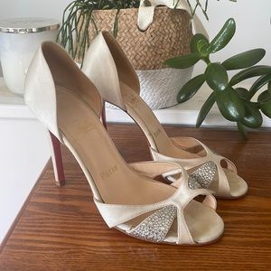 Christian Louboutin white satin and crystal embellished peep toe heels.